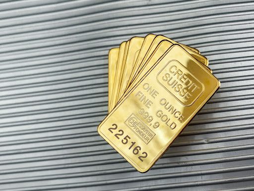 stack of credit suisse gold bars in gold trading