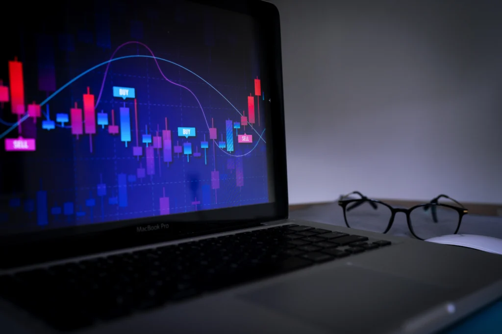laptop-displaying-a-trading-graph-with-glasses